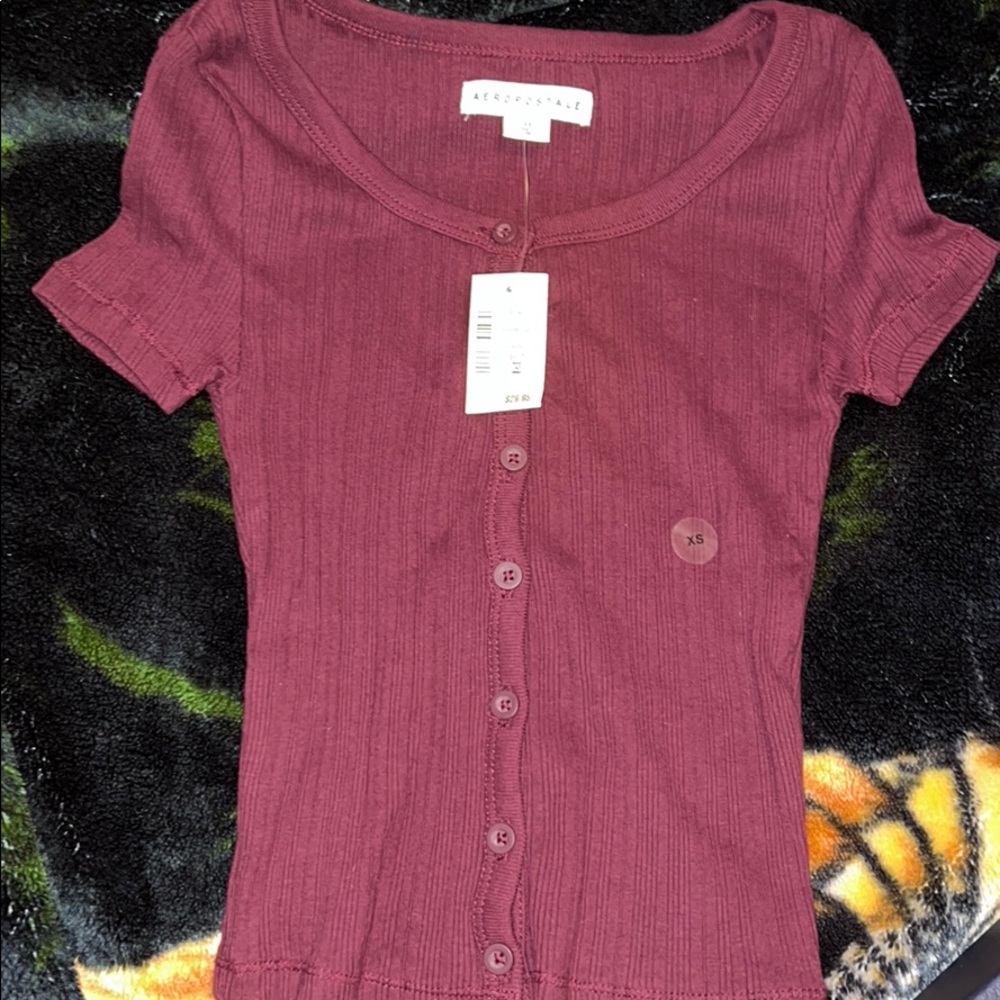 A maroon top.